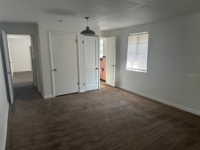 unfurnished bedroom featuring carpet