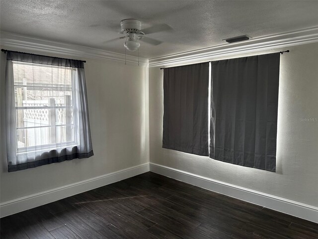 empty room featuring a textured ceiling, ceiling fan, and hardwood / wood-style floors