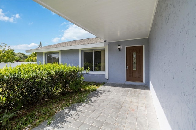 doorway to property featuring a patio