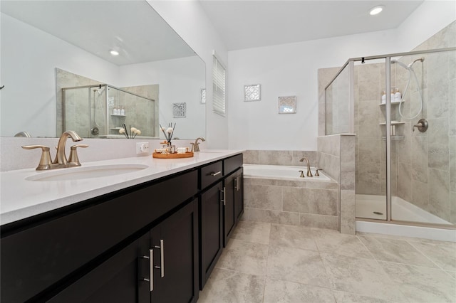 bathroom with vanity, tile patterned flooring, and independent shower and bath