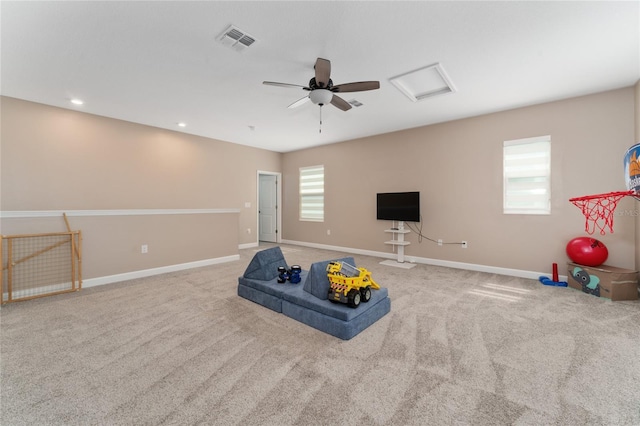 playroom with carpet and ceiling fan