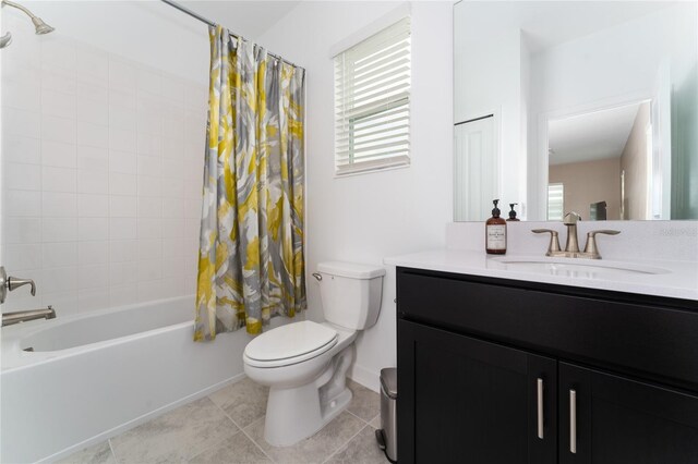 full bathroom with vanity, toilet, tile patterned flooring, and shower / bath combo