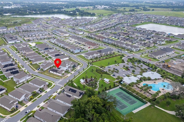 birds eye view of property featuring a water view