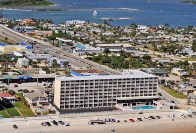 bird's eye view featuring a water view and a view of the beach