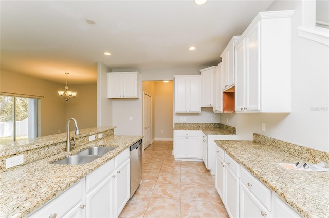 kitchen with sink, light stone counters, white cabinetry, dishwasher, and hanging light fixtures