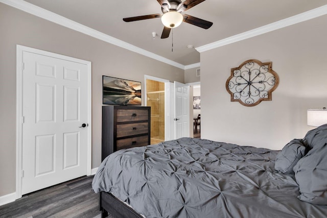 bedroom featuring ensuite bath, ornamental molding, dark wood-type flooring, and ceiling fan