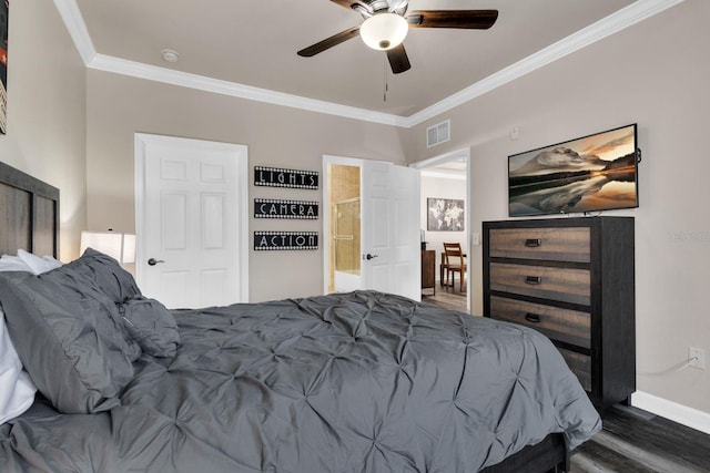 bedroom featuring ceiling fan, ornamental molding, ensuite bathroom, and dark hardwood / wood-style floors