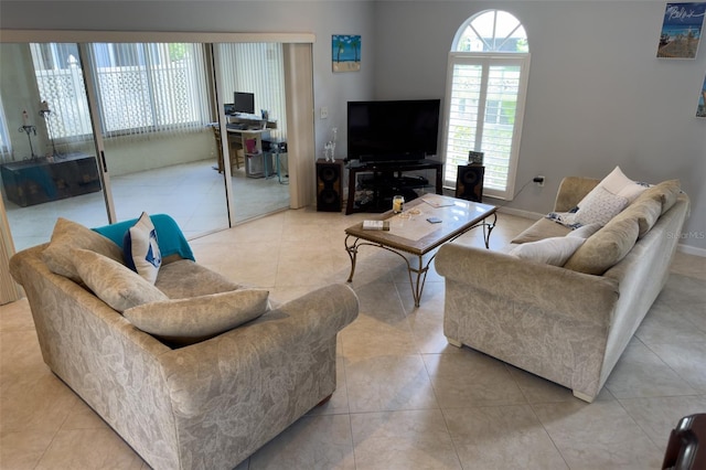 living room with light tile patterned flooring