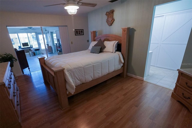 bedroom featuring ceiling fan and hardwood / wood-style floors