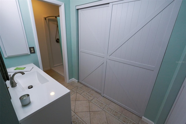 bathroom with tile patterned floors and vanity