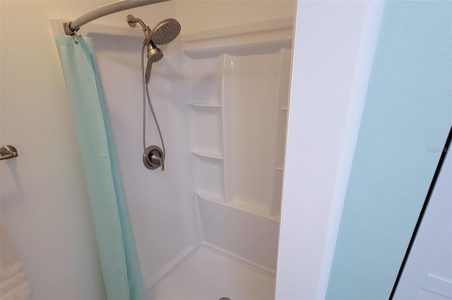 bathroom with a shower with shower curtain