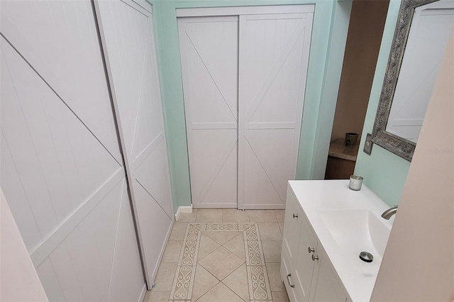 bathroom with tile patterned flooring and vanity