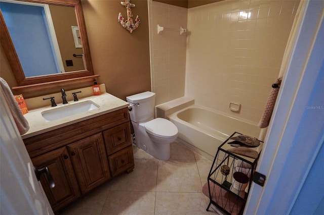 full bathroom with tile patterned flooring, vanity, toilet, and tiled shower / bath