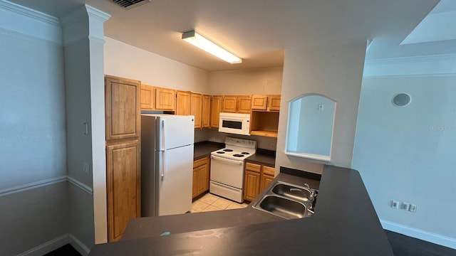 kitchen featuring crown molding, white appliances, and sink