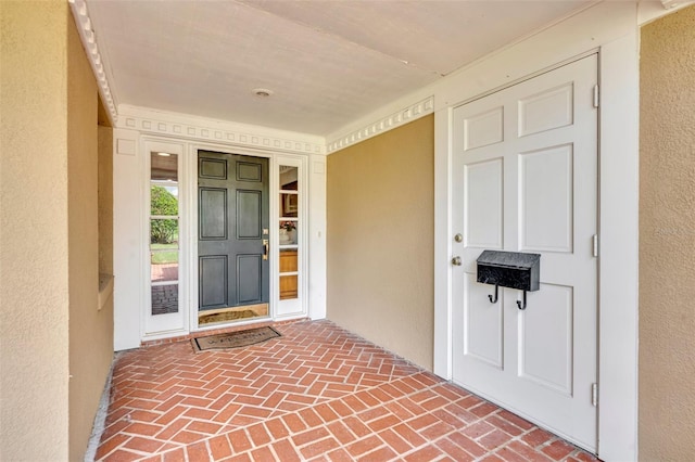 279 Rippling Ln, Winter Park, FL 32789 - doorway to property with stucco siding