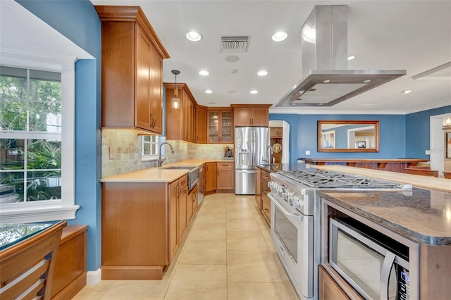 kitchen with crown molding, sink, light tile patterned floors, island exhaust hood, and stainless steel appliances