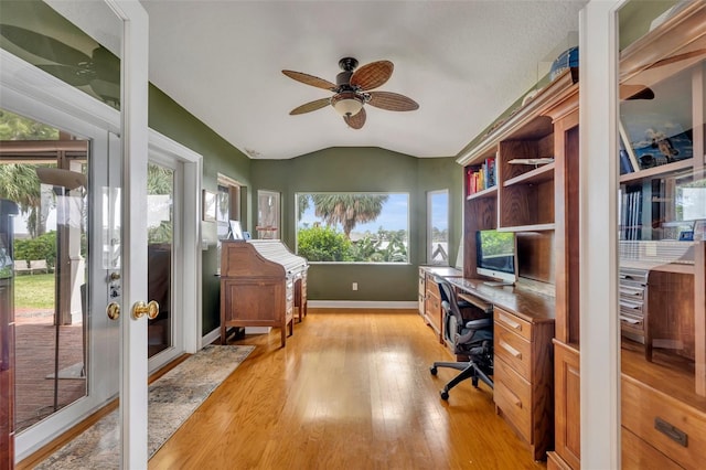 279 Rippling Ln, Winter Park, FL 32789 - office area featuring light wood-type flooring, vaulted ceiling, a ceiling fan, baseboards, and french doors