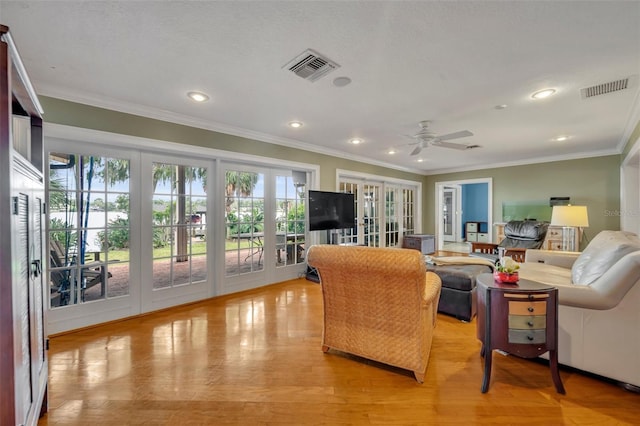 279 Rippling Ln, Winter Park, FL 32789 - living area with french doors, plenty of natural light, a ceiling fan, ornamental molding, and recessed lighting