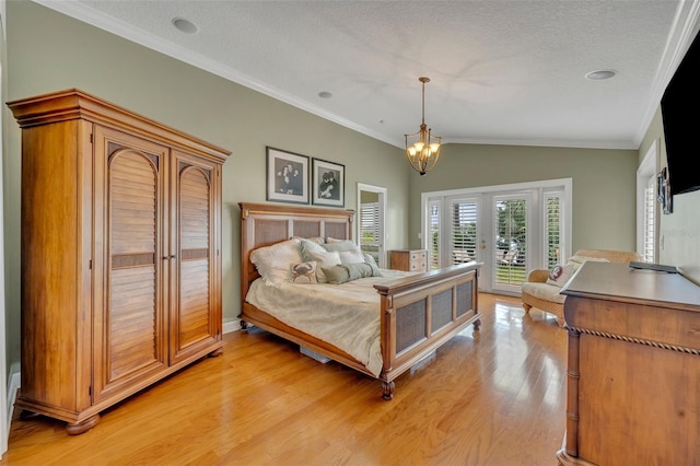 279 Rippling Ln, Winter Park, FL 32789 - bedroom with access to exterior, light wood-style flooring, a chandelier, vaulted ceiling, and ornamental molding