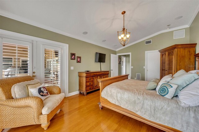 bedroom with an inviting chandelier, crown molding, vaulted ceiling, access to outside, and light wood-type flooring