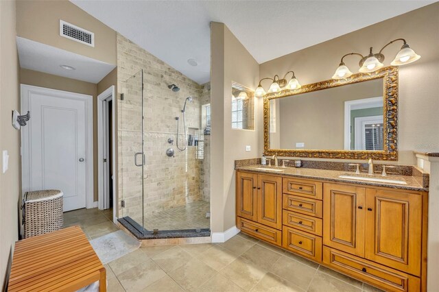 bathroom featuring tile patterned floors, vanity, an enclosed shower, and lofted ceiling