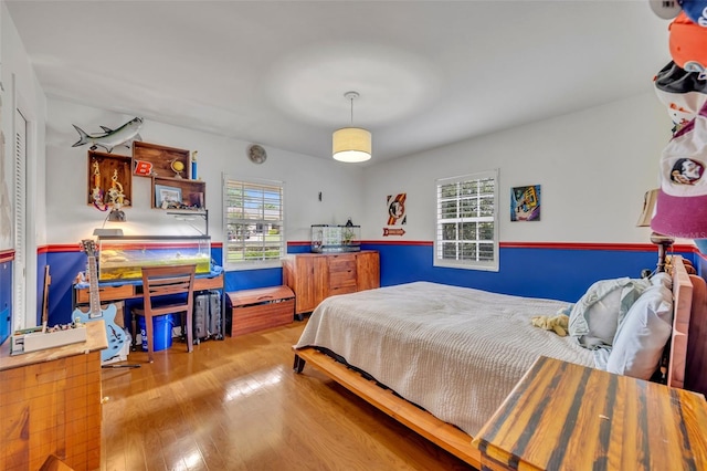 bedroom featuring wood-type flooring