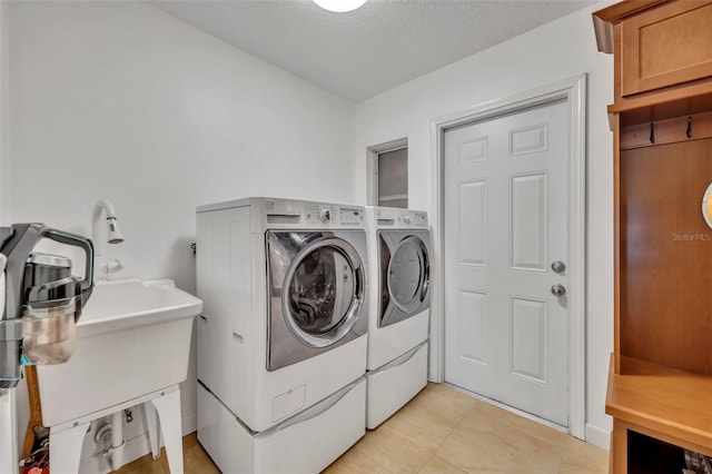 279 Rippling Ln, Winter Park, FL 32789 - laundry area featuring washer and dryer and a textured ceiling
