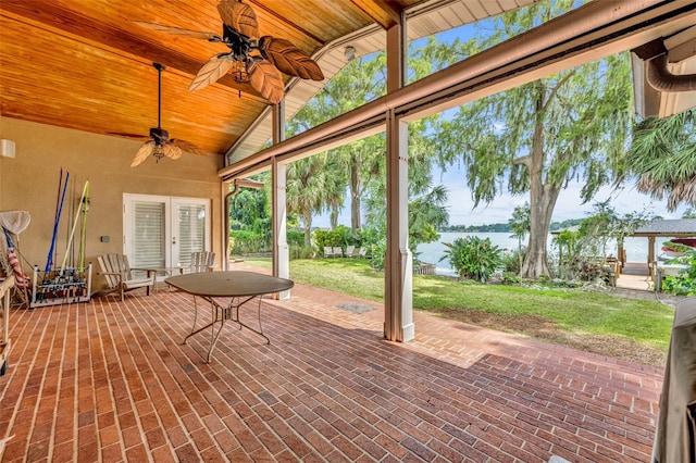 view of patio / terrace with a water view and ceiling fan