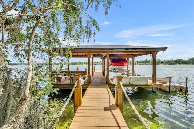 279 Rippling Ln, Winter Park, FL 32789 - dock featuring boat lift and a water view