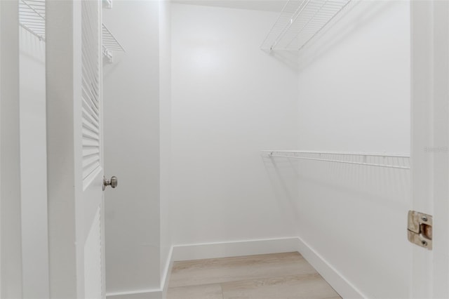 spacious closet with light wood-type flooring