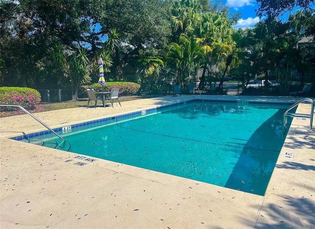 community pool with fence