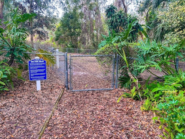 view of gate featuring fence