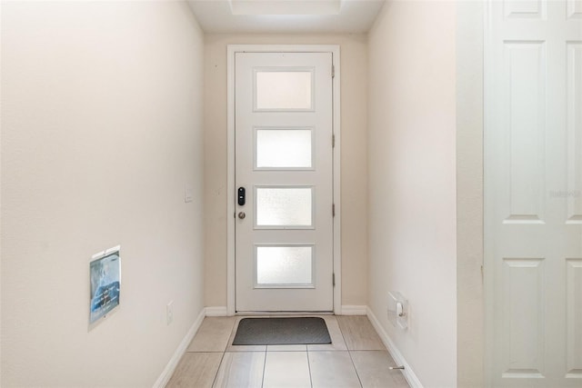 doorway to outside featuring light tile patterned floors