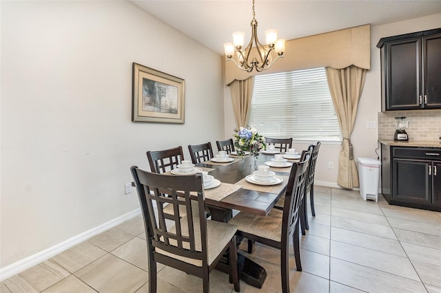 dining room with light tile patterned flooring and an inviting chandelier