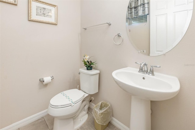 bathroom featuring tile patterned floors and toilet