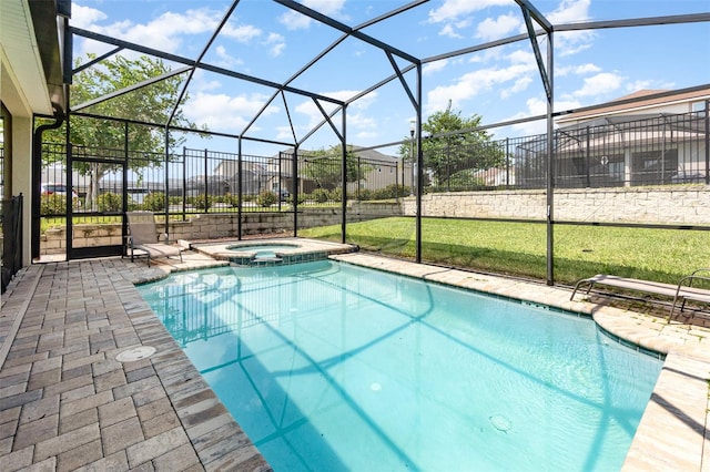 view of swimming pool featuring glass enclosure and an in ground hot tub