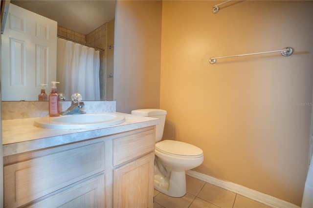 bathroom with vanity, tile patterned floors, and toilet