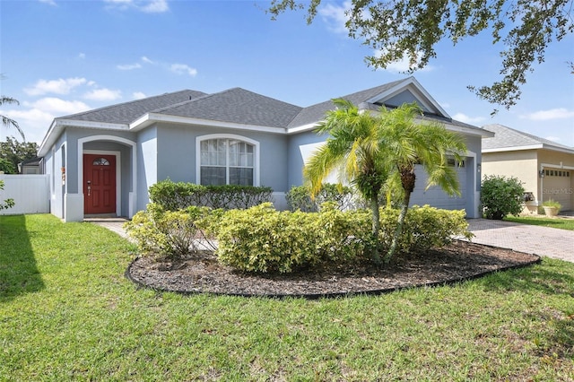 view of front facade featuring a garage and a front yard