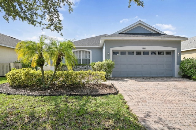 single story home featuring a garage