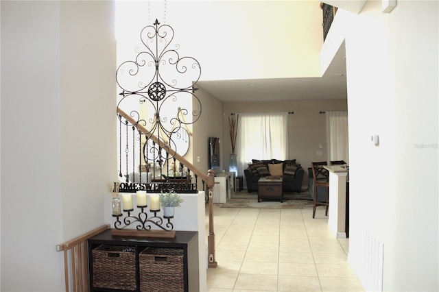 hall featuring light tile patterned flooring