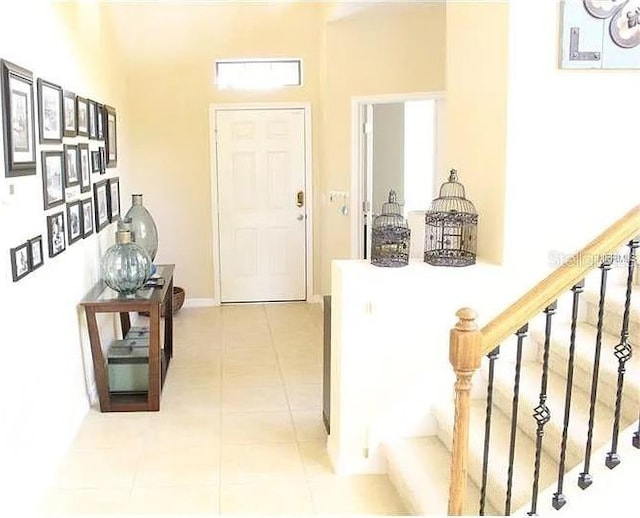 hall with light tile patterned floors