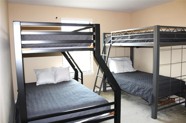 bedroom featuring light colored carpet