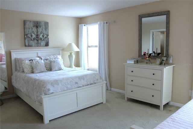 bedroom with light carpet