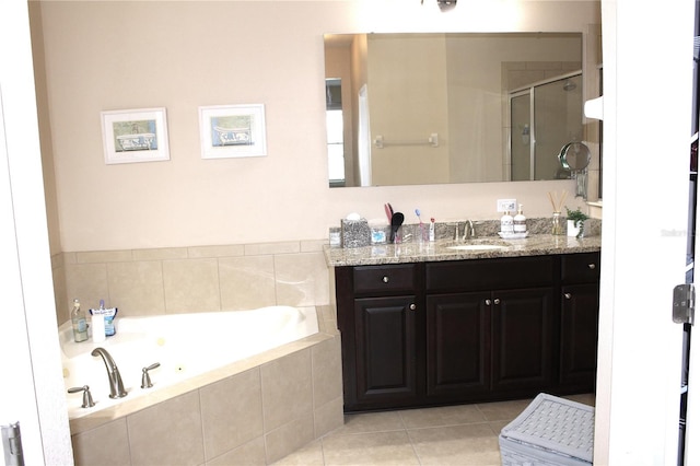 bathroom featuring tile patterned floors, vanity, and separate shower and tub