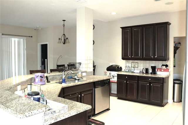 kitchen with stainless steel dishwasher, backsplash, light tile patterned floors, sink, and dark brown cabinetry