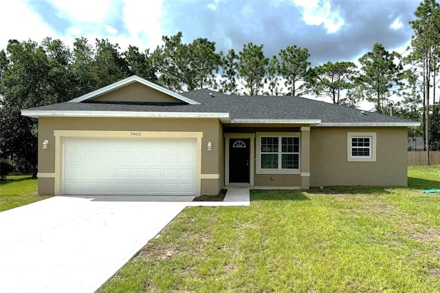 ranch-style house featuring a front yard and a garage