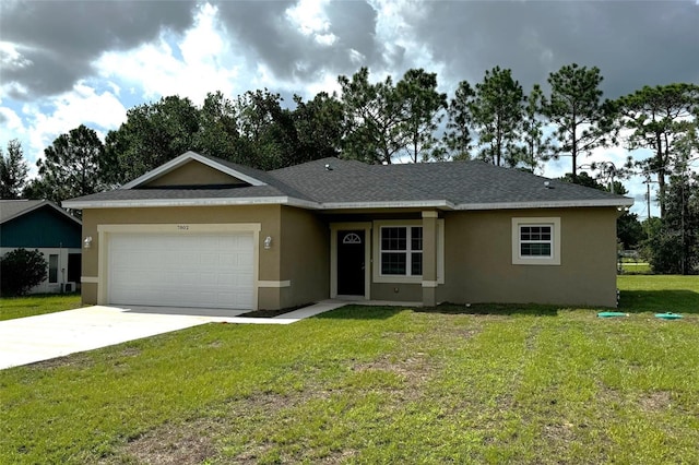 ranch-style home with a garage and a front lawn