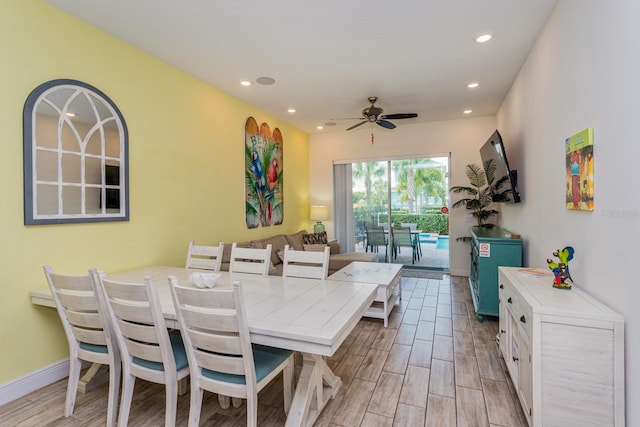 dining area with light hardwood / wood-style flooring and ceiling fan