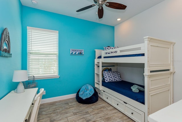 bedroom with ceiling fan and light wood-type flooring