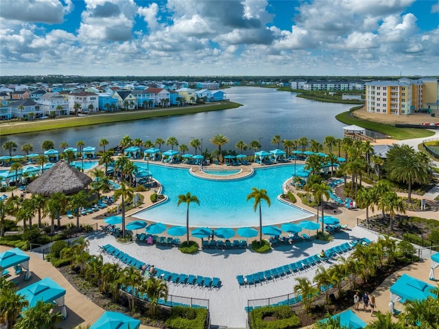 birds eye view of property with a water view